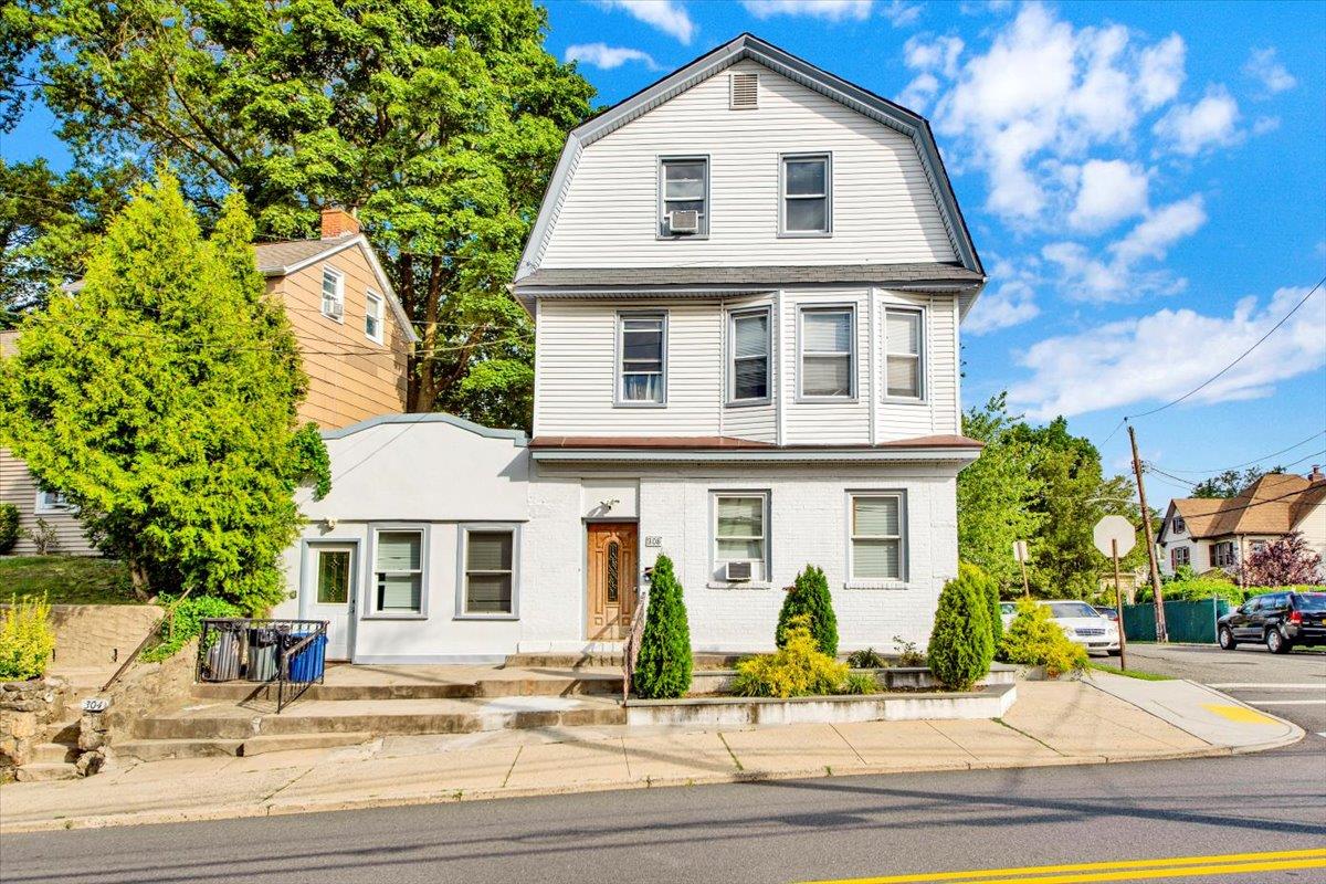 308 5th Avenue New Rochelle, NY 10801 - Photo 2 of 37 a front view of a house with a yard