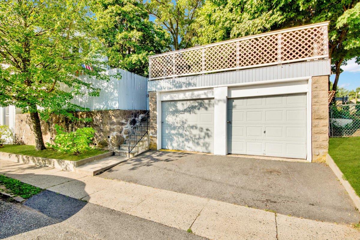 308 5th Avenue New Rochelle, NY 10801 - Photo 27 of 37 a front view of a house with a yard