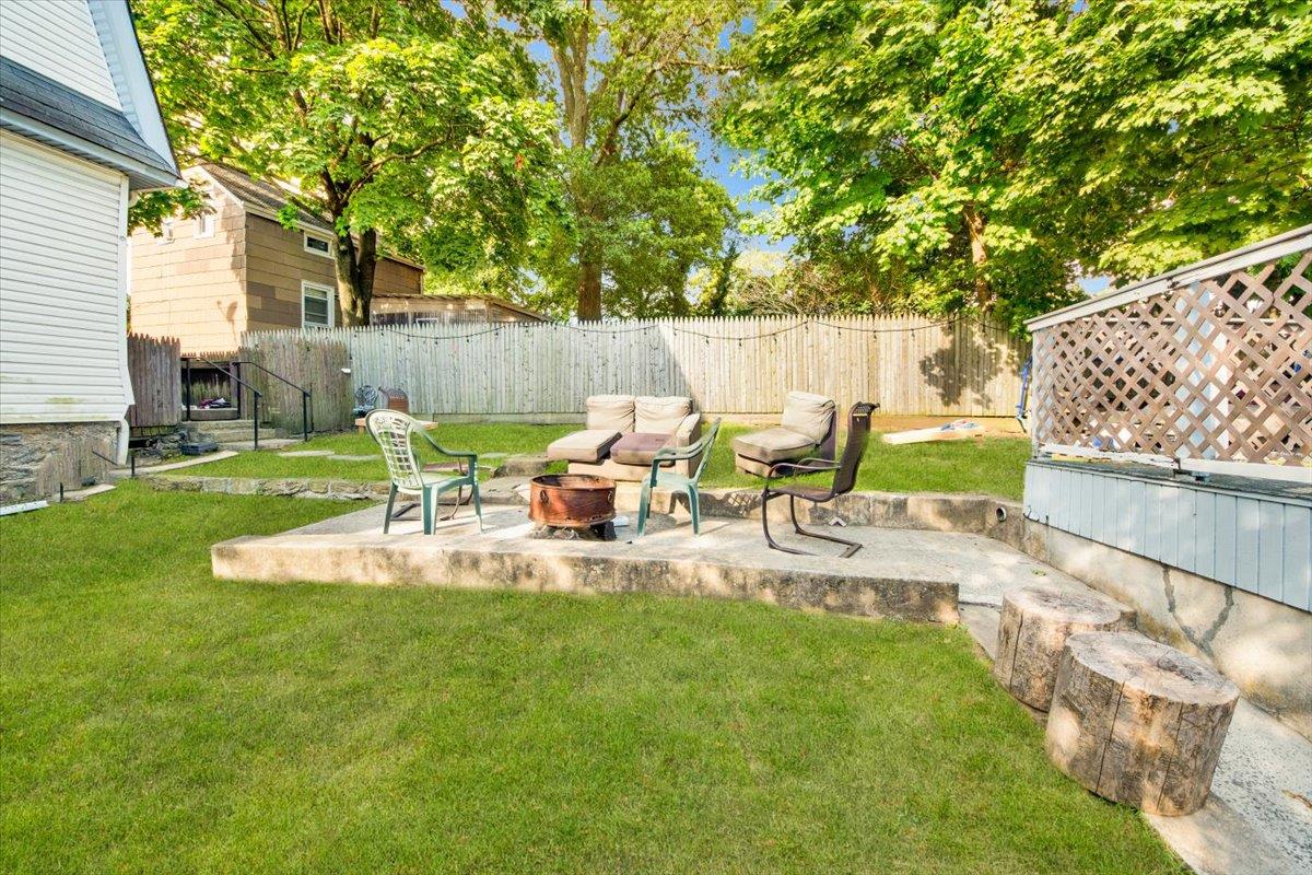308 5th Avenue New Rochelle, NY 10801 - Photo 32 of 37 a view of backyard with table and chairs and a large tree