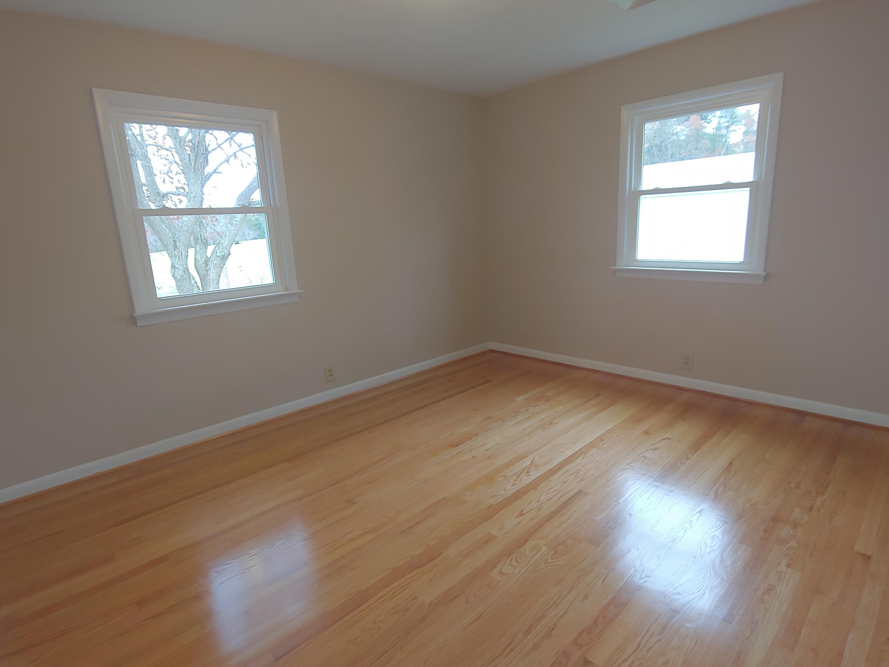 706 Alum Ridge Road Northwest Willis, VA 24380 - Photo 28 of 56 a view of empty room with wooden floor and fan