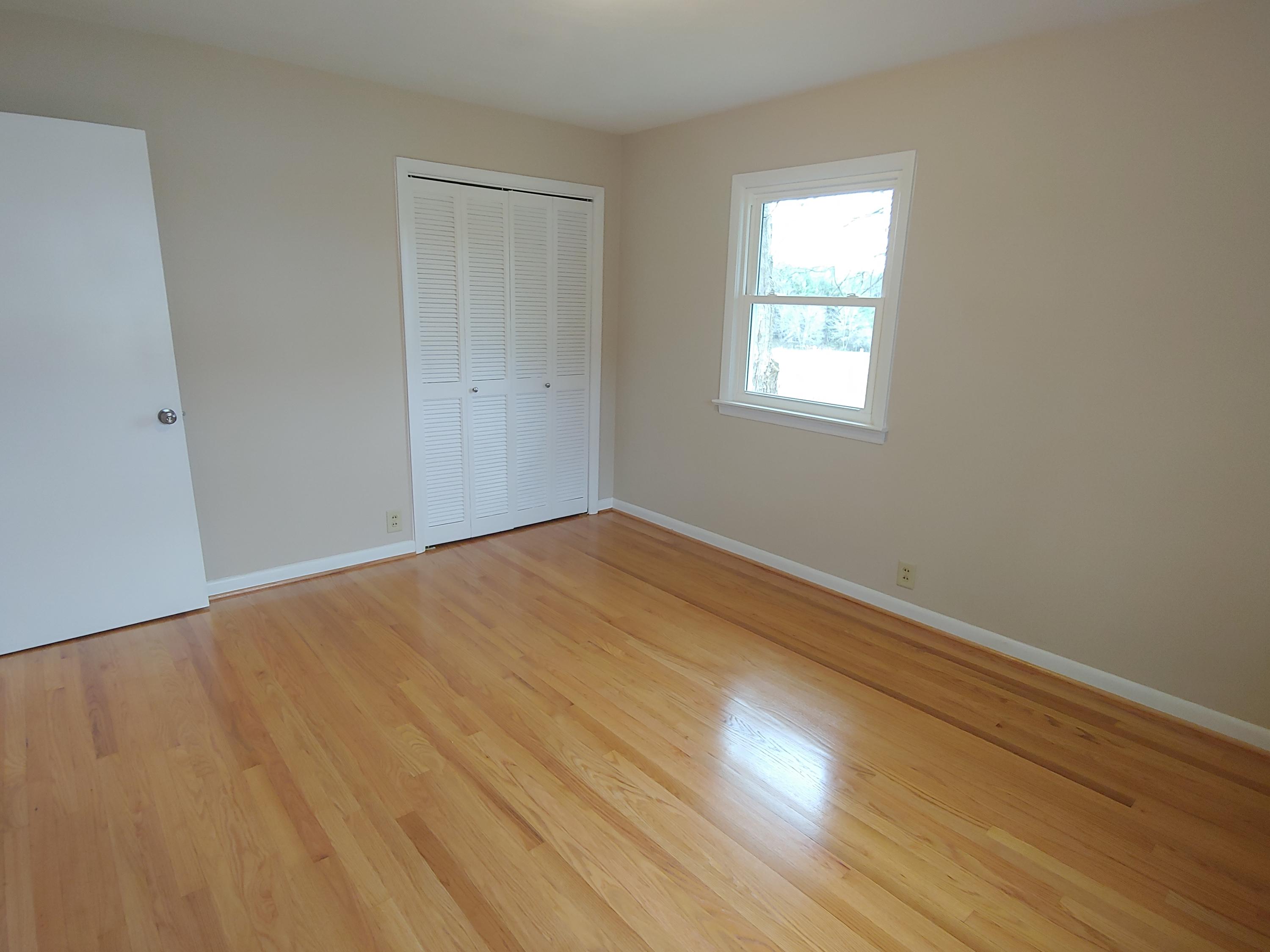 706 Alum Ridge Road Northwest Willis, VA 24380 - Photo 29 of 56 a view of empty room with wooden floor and fan
