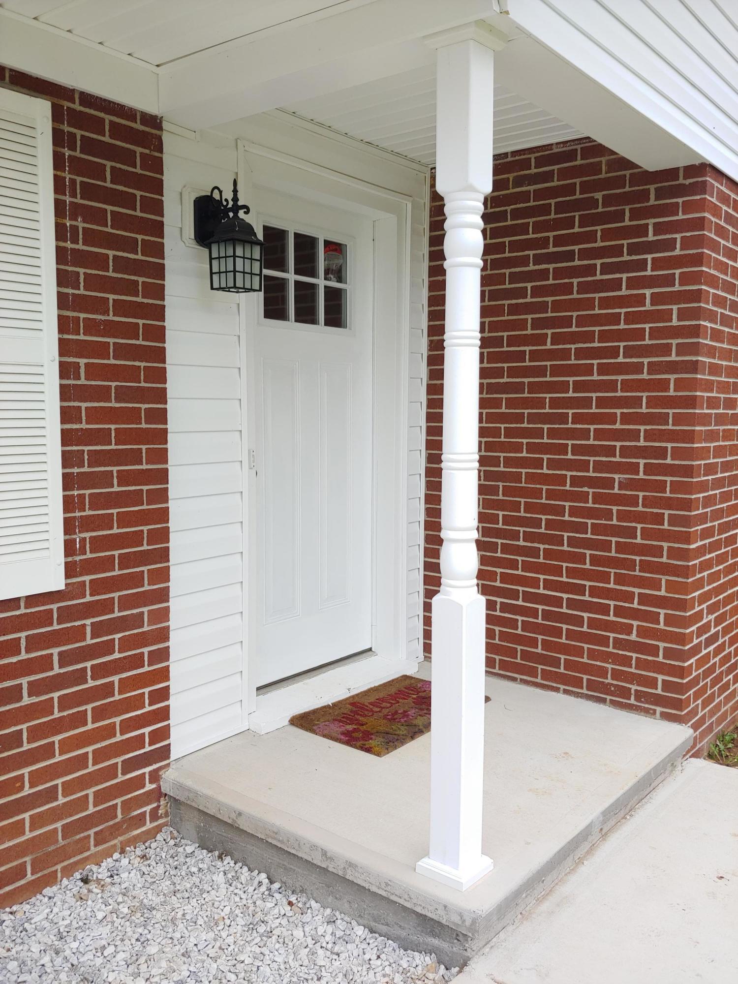 706 Alum Ridge Road Northwest Willis, VA 24380 - Photo 40 of 56 a front view of a building with entryway