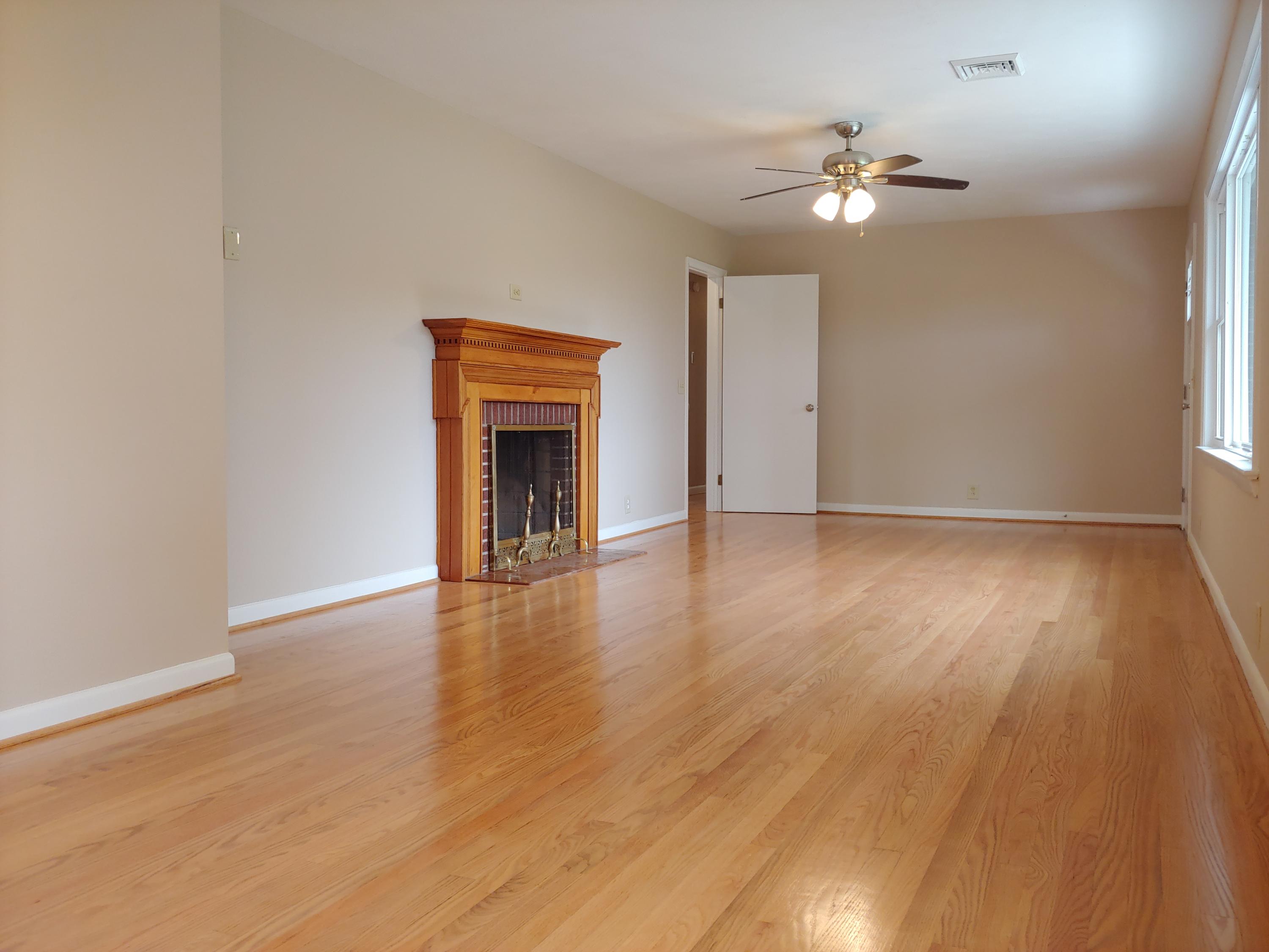 706 Alum Ridge Road Northwest Willis, VA 24380 - Photo 6 of 56 a view of an empty room with wooden floor and a window
