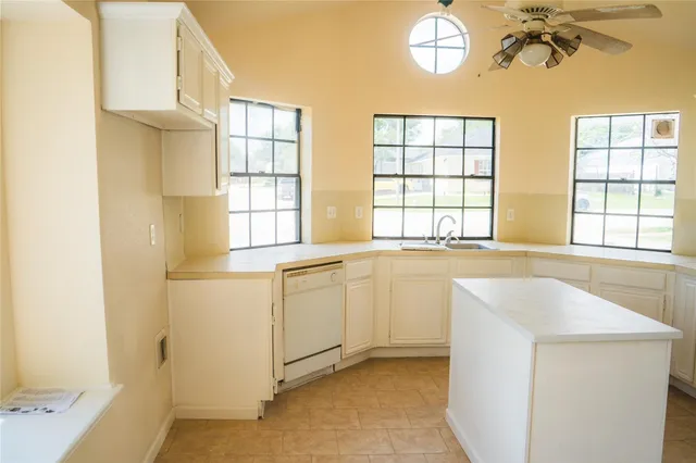 a spacious bathroom with a bathtub and a shower