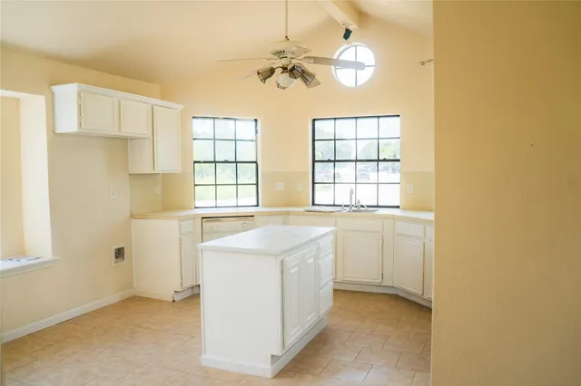 a kitchen with a sink and a window