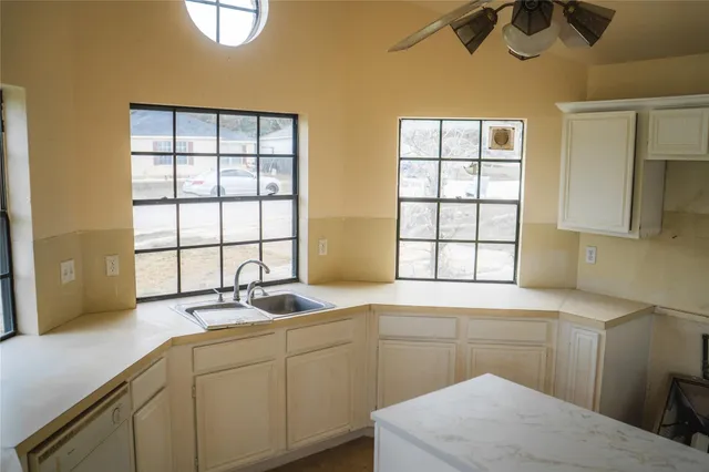 a bathroom with a bathtub and a sink