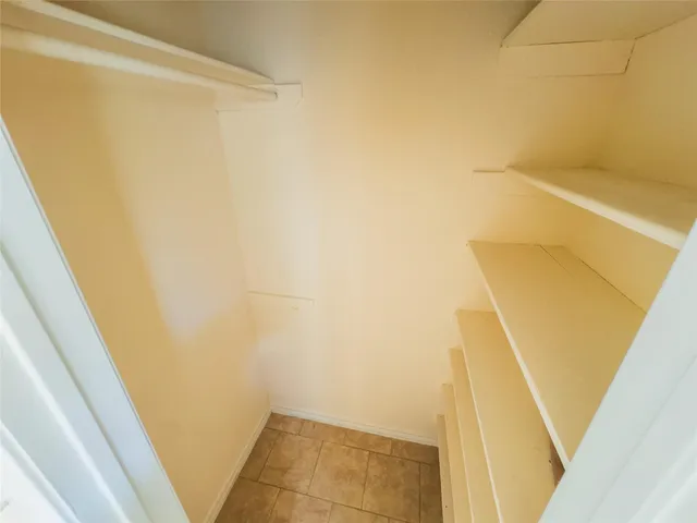 a view of a kitchen with a sink and dishwasher a refrigerator with wooden floor