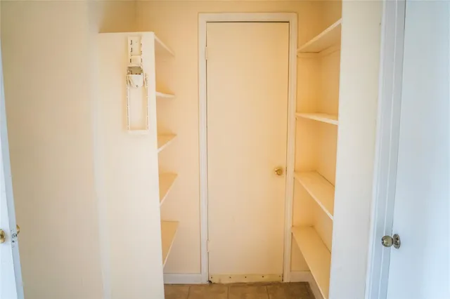 a kitchen with a sink and a refrigerator