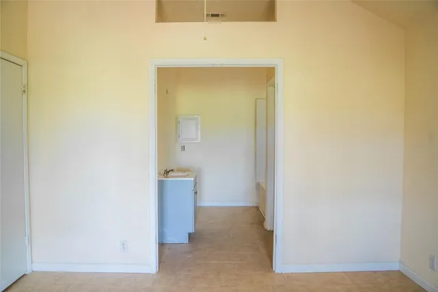 a view of a hallway with a chandelier