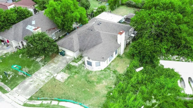 a view of a yard with potted plants