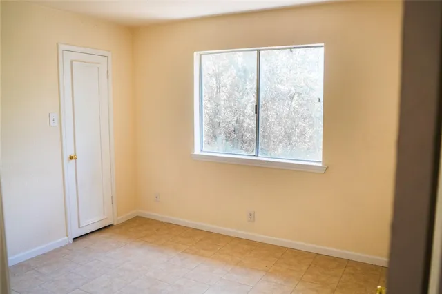 an empty room with a window