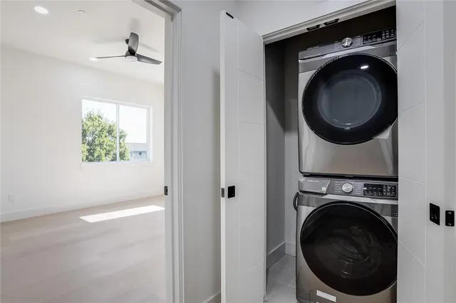 a view of a hallway with washer and dryer