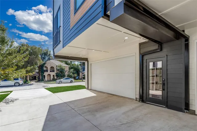 a view of a house with a yard and porch