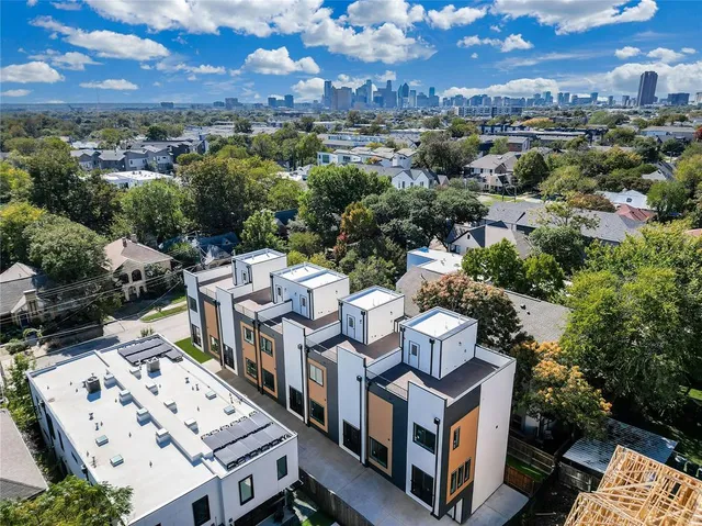 an aerial view of a residential apartment building with a city view
