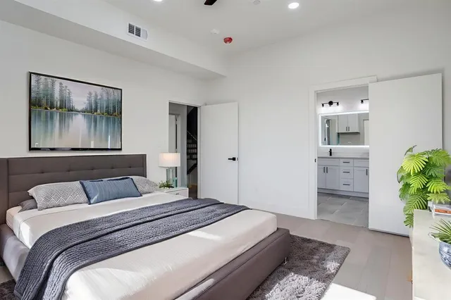 a bedroom with a bed and a couch