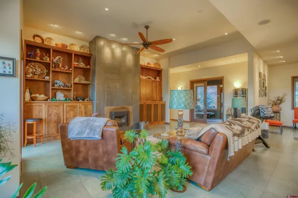 a living room with furniture and a fireplace