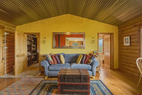 a bedroom with a bed and a large window with outer view