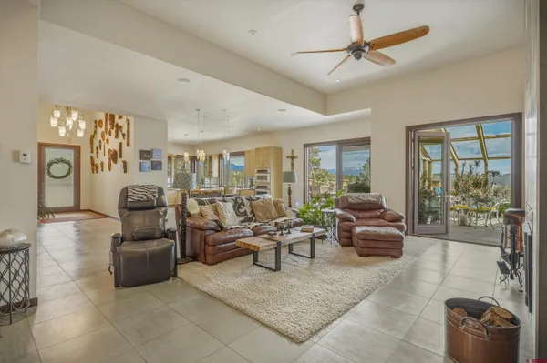 a living room with furniture a fireplace and a table