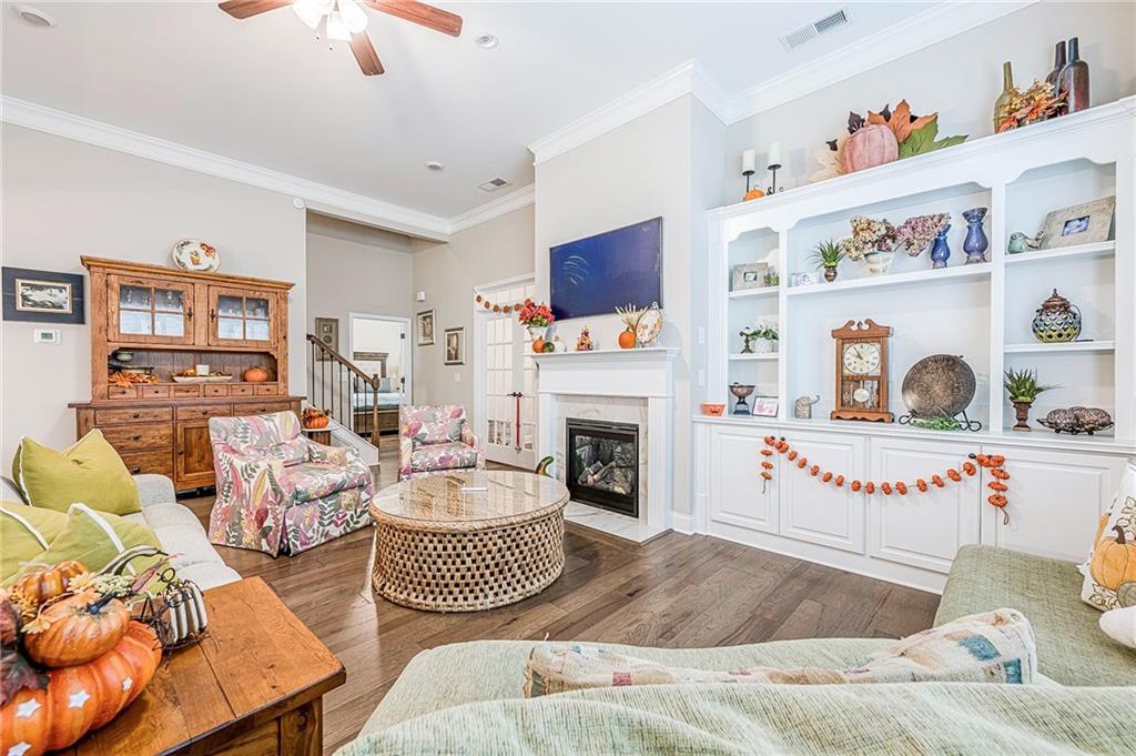 701 Calypso Way Cumming, GA 30040 - Photo 22 of 54 a living room with furniture and a fireplace