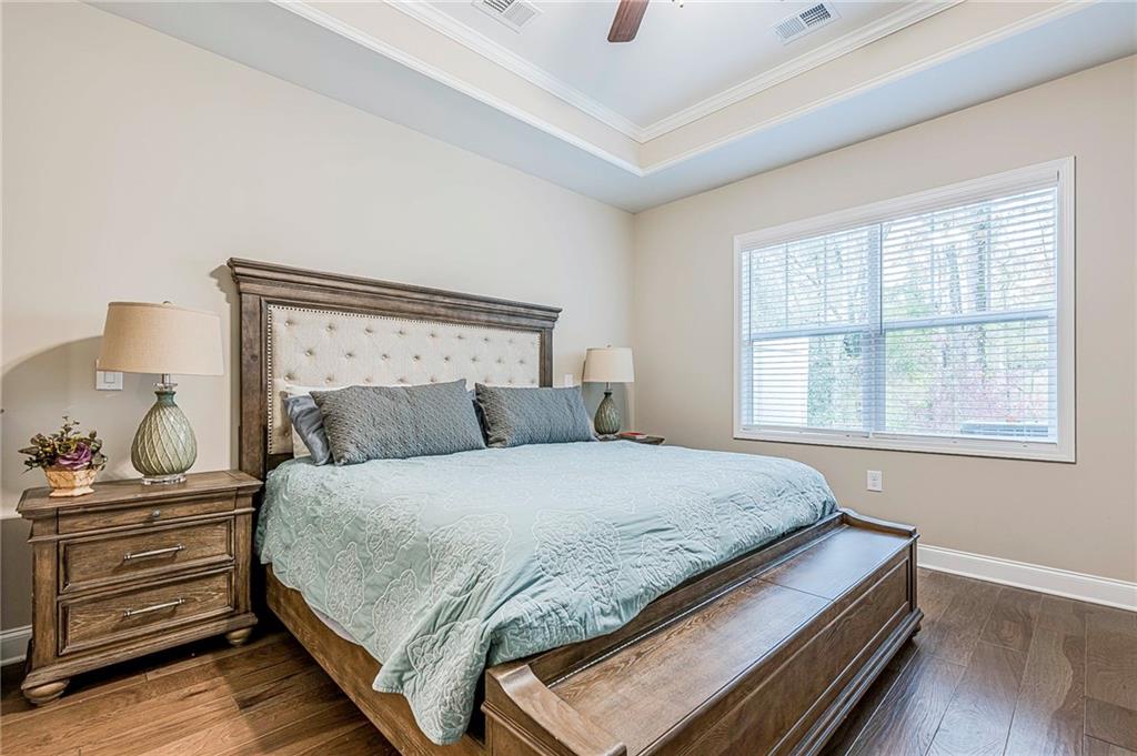 701 Calypso Way Cumming, GA 30040 - Photo 24 of 54 a bedroom with a bed and a window