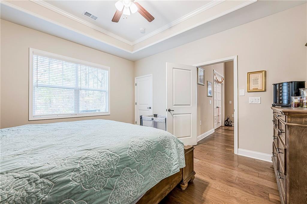 701 Calypso Way Cumming, GA 30040 - Photo 27 of 54 a bedroom with a bed and a window