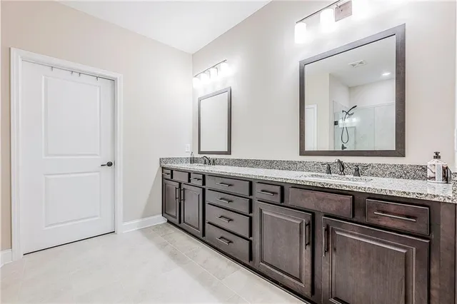 a kitchen with a stove and white cabinets