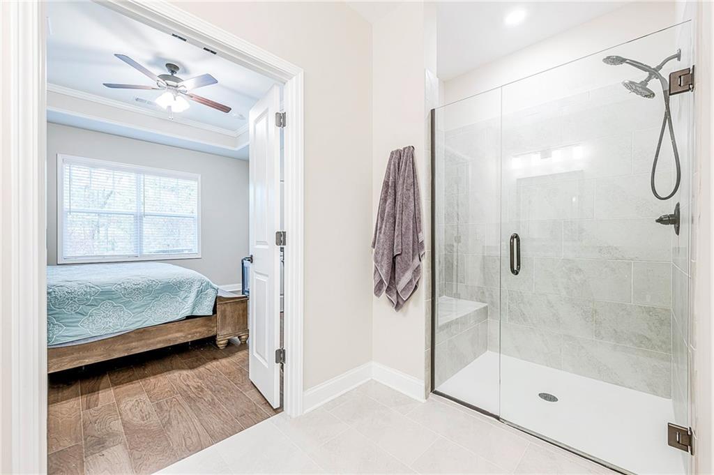 701 Calypso Way Cumming, GA 30040 - Photo 30 of 54 a bedroom with a bed and a window