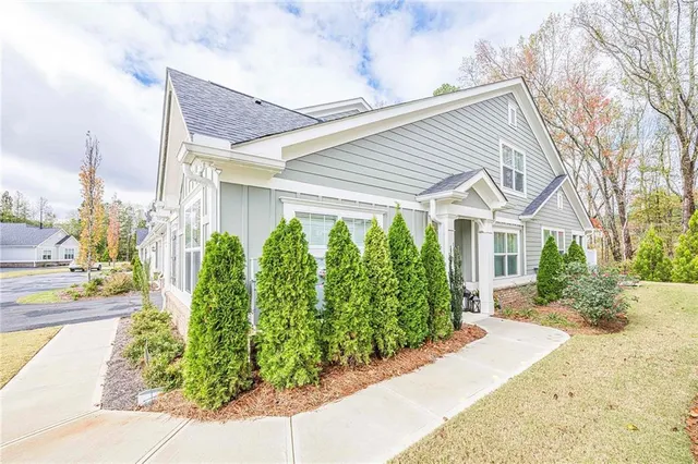 a front view of a house with garden