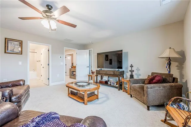 a front view of a house with swimming pool and outdoor seating