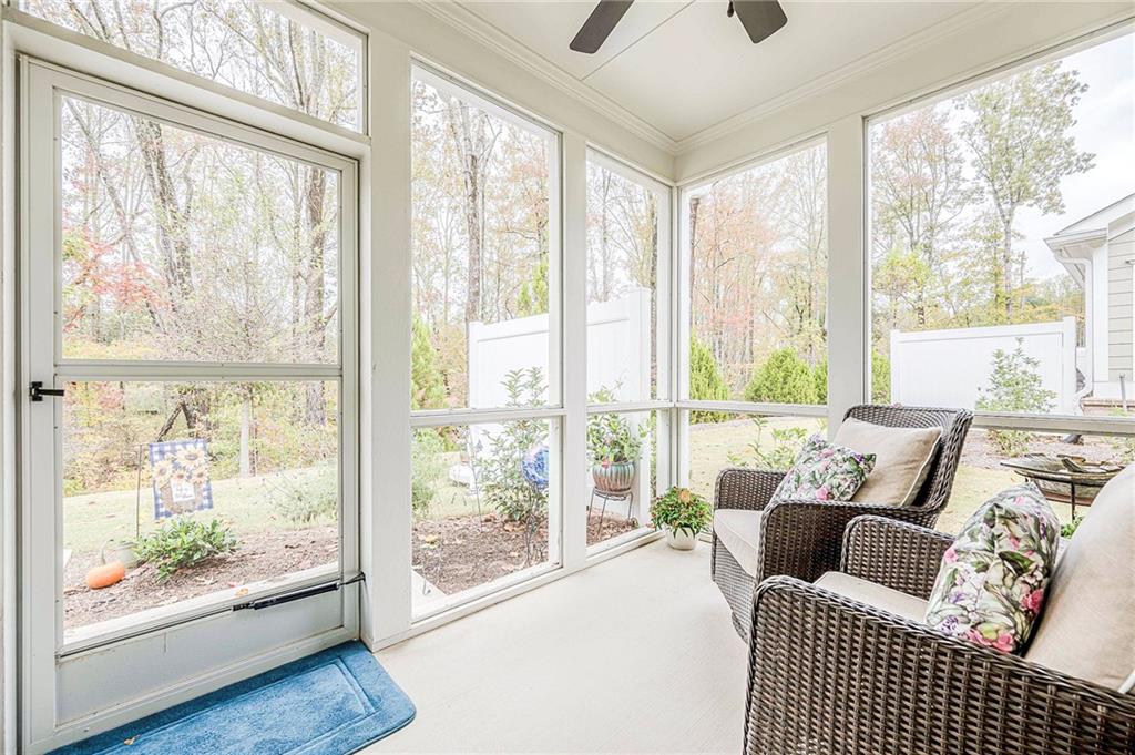 701 Calypso Way Cumming, GA 30040 - Photo 39 of 54 a living room with furniture and a large window
