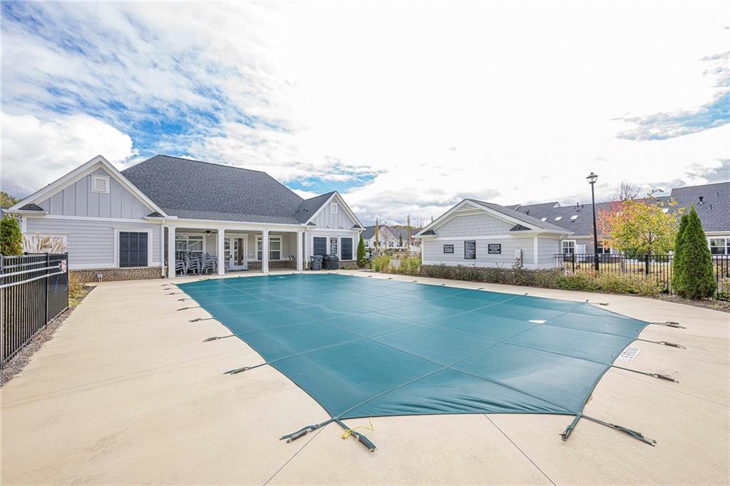 701 Calypso Way Cumming, GA 30040 - Photo 47 of 54 a front view of a house with swimming pool