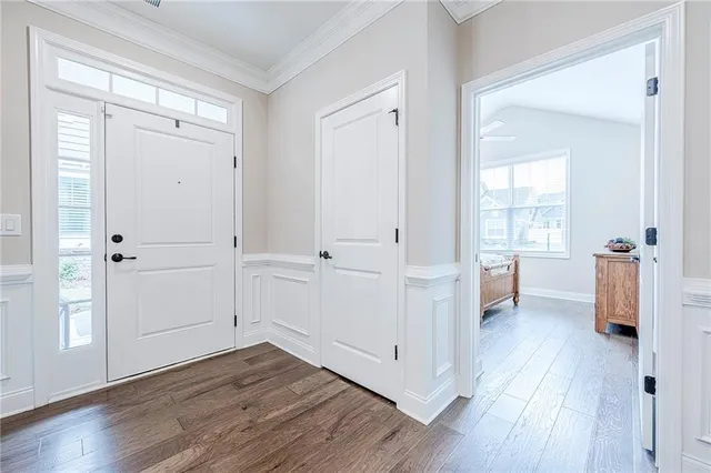 a view of a dining area with furniture and wooden floor