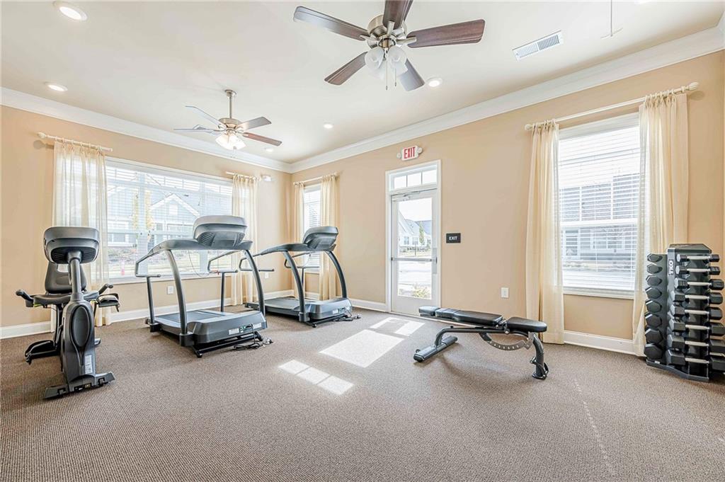 701 Calypso Way Cumming, GA 30040 - Photo 53 of 54 a view of a room with gym equipment