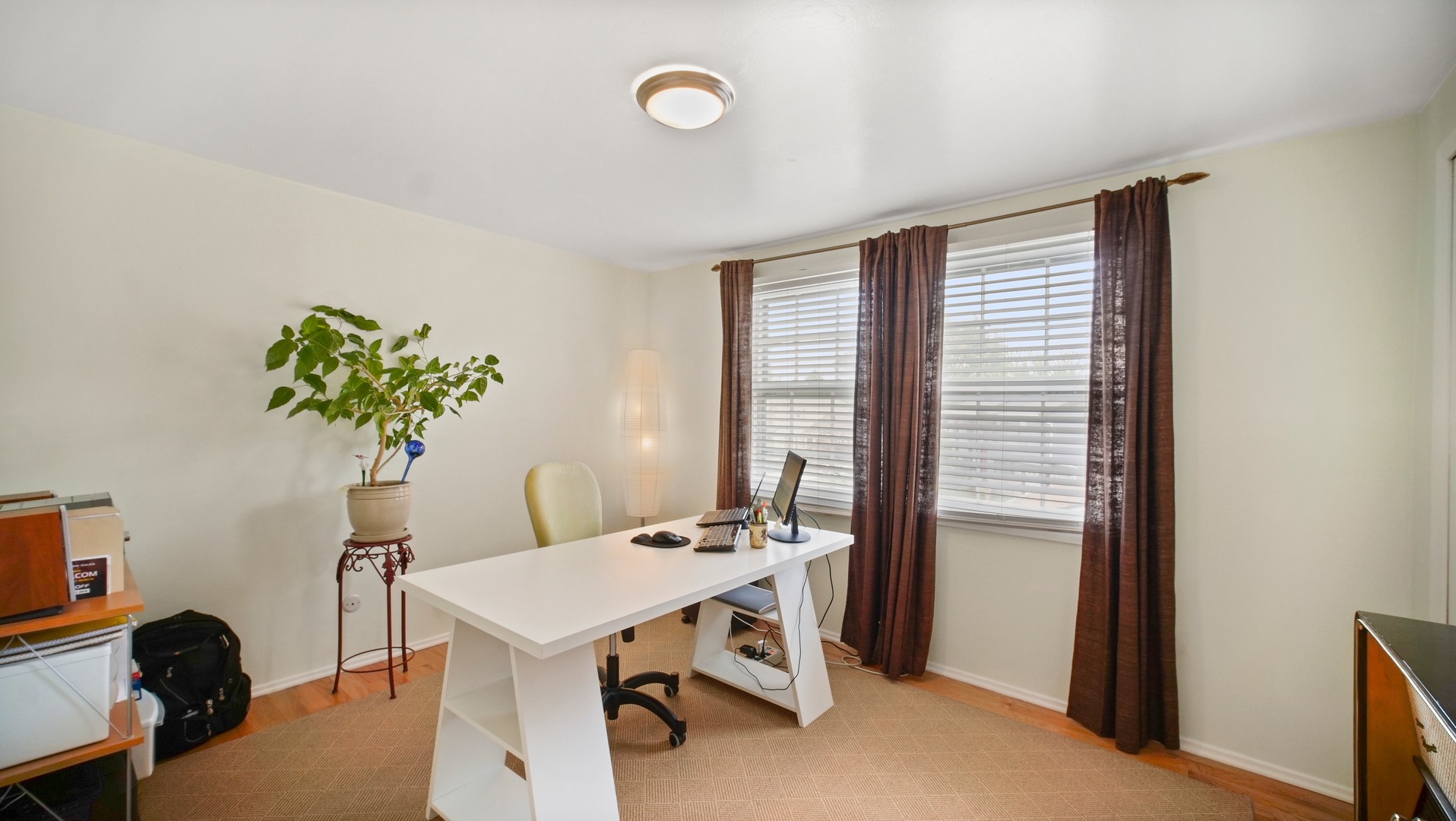 30 Timber Hill Road Buffalo Grove, IL 60089 - Photo 17 of 23 a view of a workspace with furniture and a potted plant
