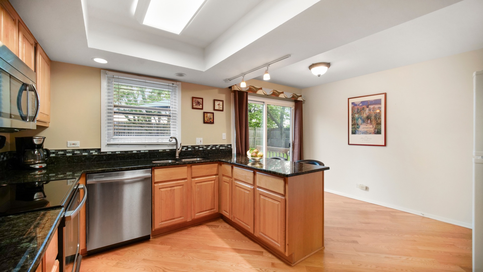 30 Timber Hill Road Buffalo Grove, IL 60089 - Photo 8 of 23 a kitchen with stainless steel appliances granite countertop a stove a sink and a microwave