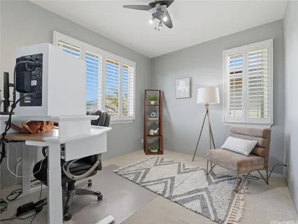 a work room with furniture and a window