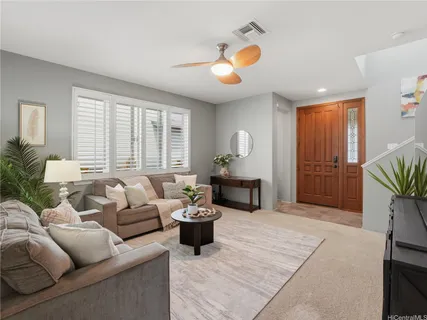 a living room with furniture and a large window