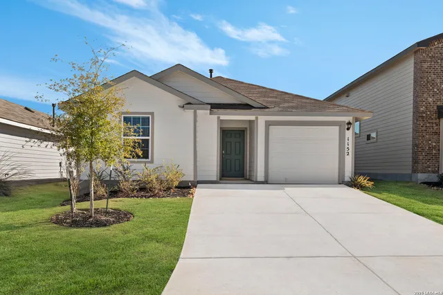 a front view of house with a yard