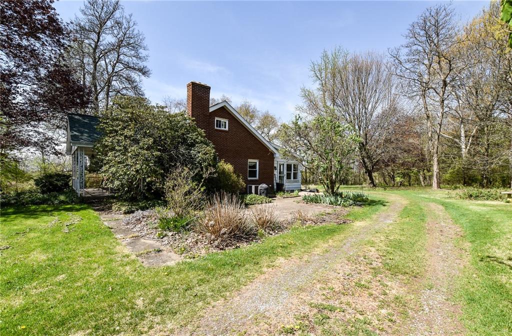 109 Neupert Road Cabot, PA 16023 - Photo 13 of 17 a view of a house with a yard and tree s