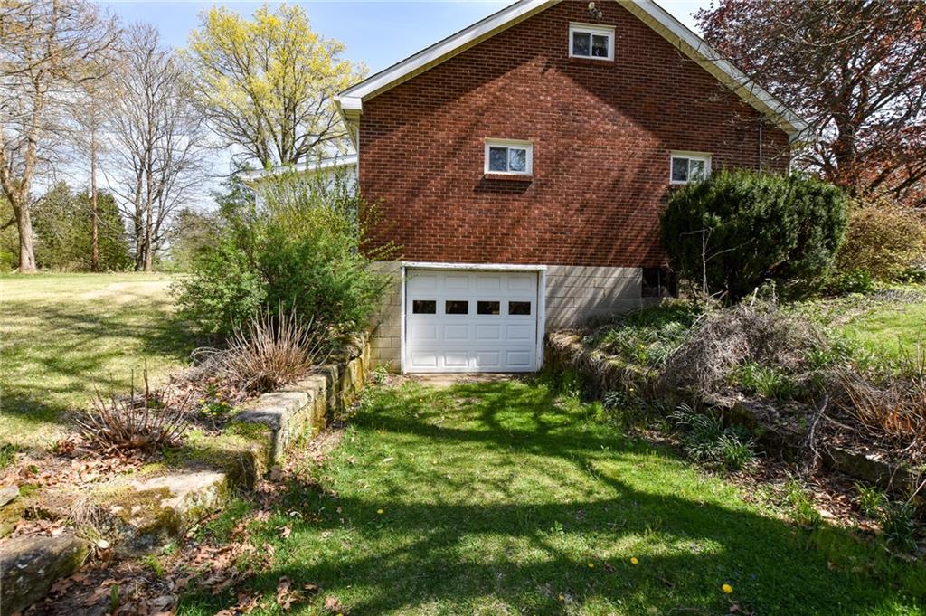 109 Neupert Road Cabot, PA 16023 - Photo 14 of 17 a front view of house with a garden