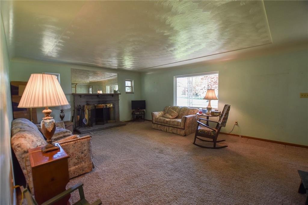 109 Neupert Road Cabot, PA 16023 - Photo 4 of 17 a living room with furniture and a fireplace