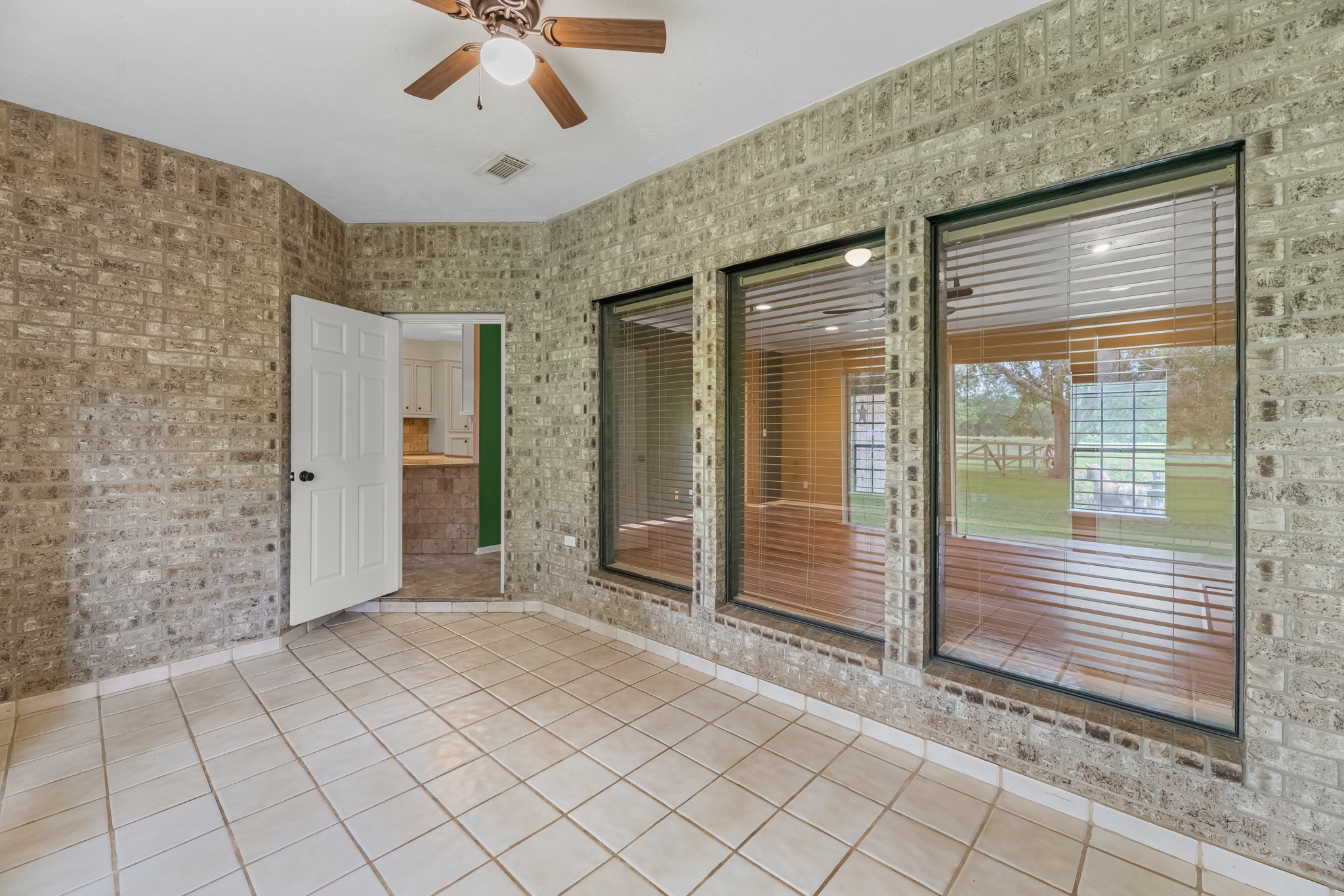 17126 County Road 39 Rosharon, TX 77583 - Photo 13 of 47 Inset sunroom is a great space that opens from garage, also goes to backyard and home. It is not added to the overall square footage.