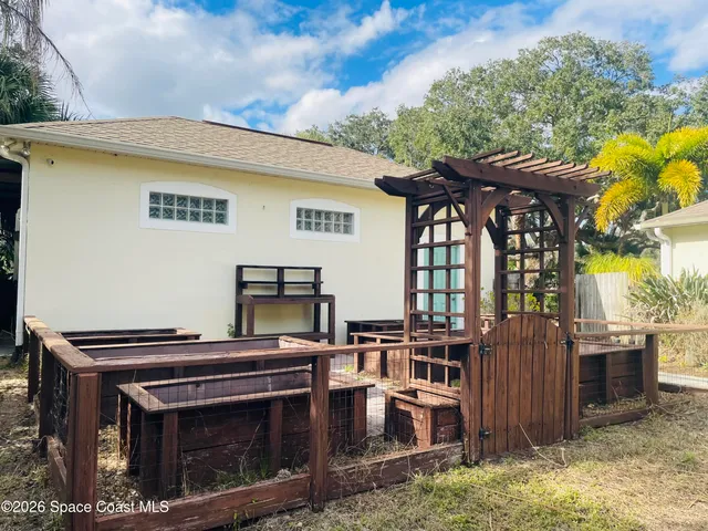 a view of a chairs and table in the patio
