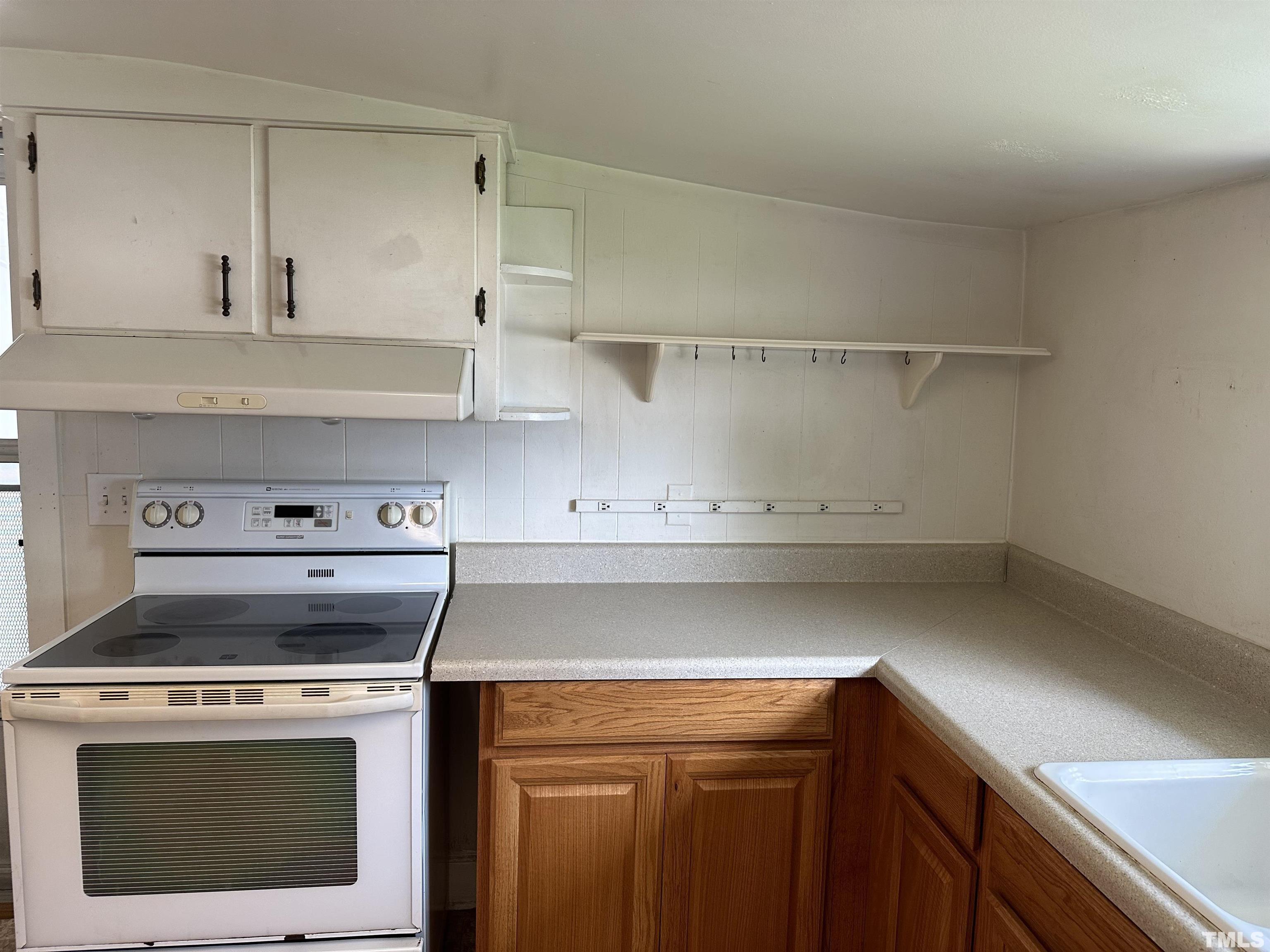 265 Iris Bryant Road Erwin, NC 28339 - Photo 3 of 11 a stove top oven sitting inside of a kitchen