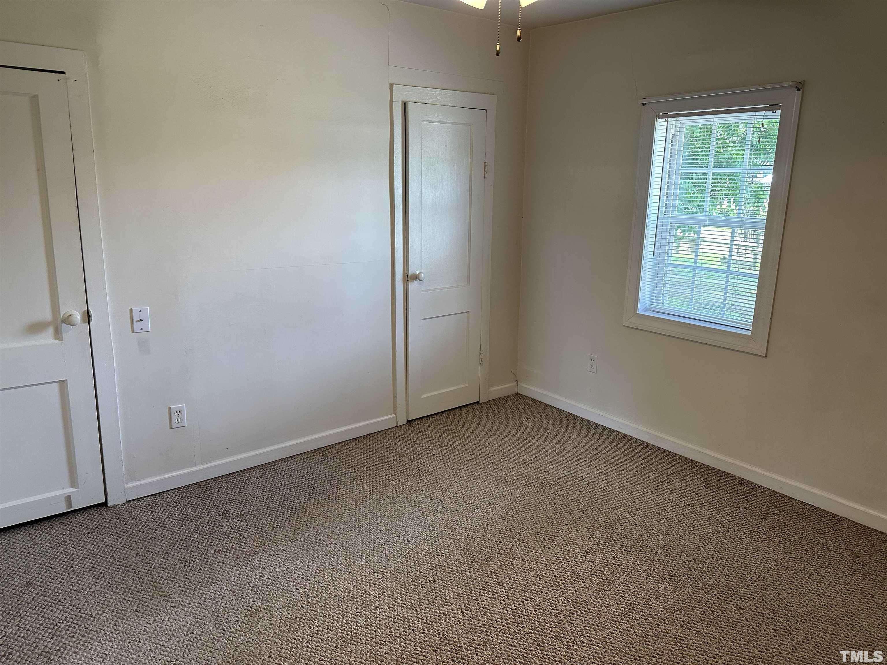 265 Iris Bryant Road Erwin, NC 28339 - Photo 5 of 11 an empty room with a window
