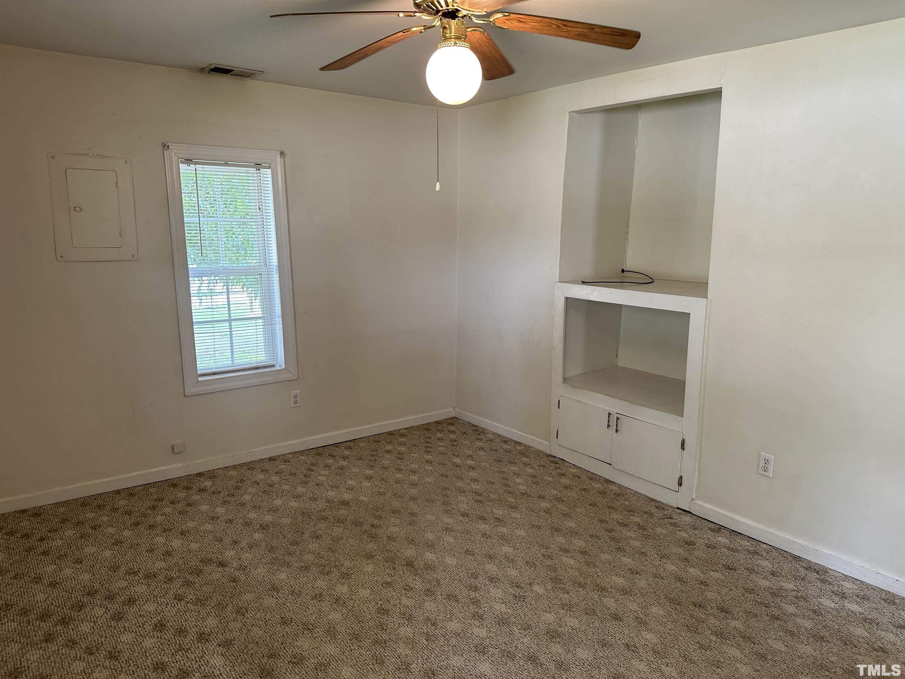 265 Iris Bryant Road Erwin, NC 28339 - Photo 9 of 11 an empty room with windows