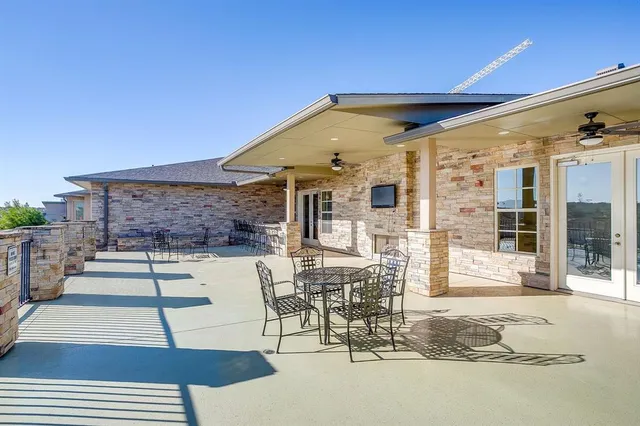 a front view of a house with a garden and plants