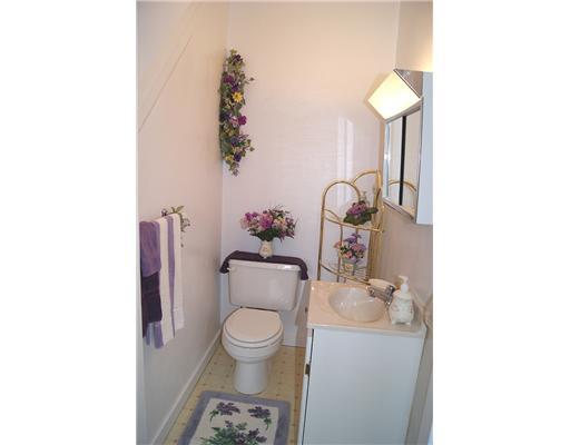 512 Friday Road Pittsburgh, PA 15209 - Photo 7 of 14 1st Floor Plan. First floor powder room with white cabinet and medicine cabinet.