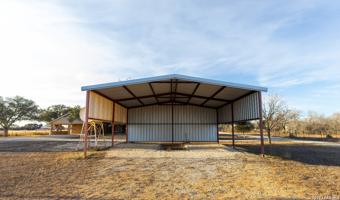 375 Bluntzer Road Jourdanton, TX 78026 - Photo 16 of 44 a view of a house with a snow yard and covered with snow