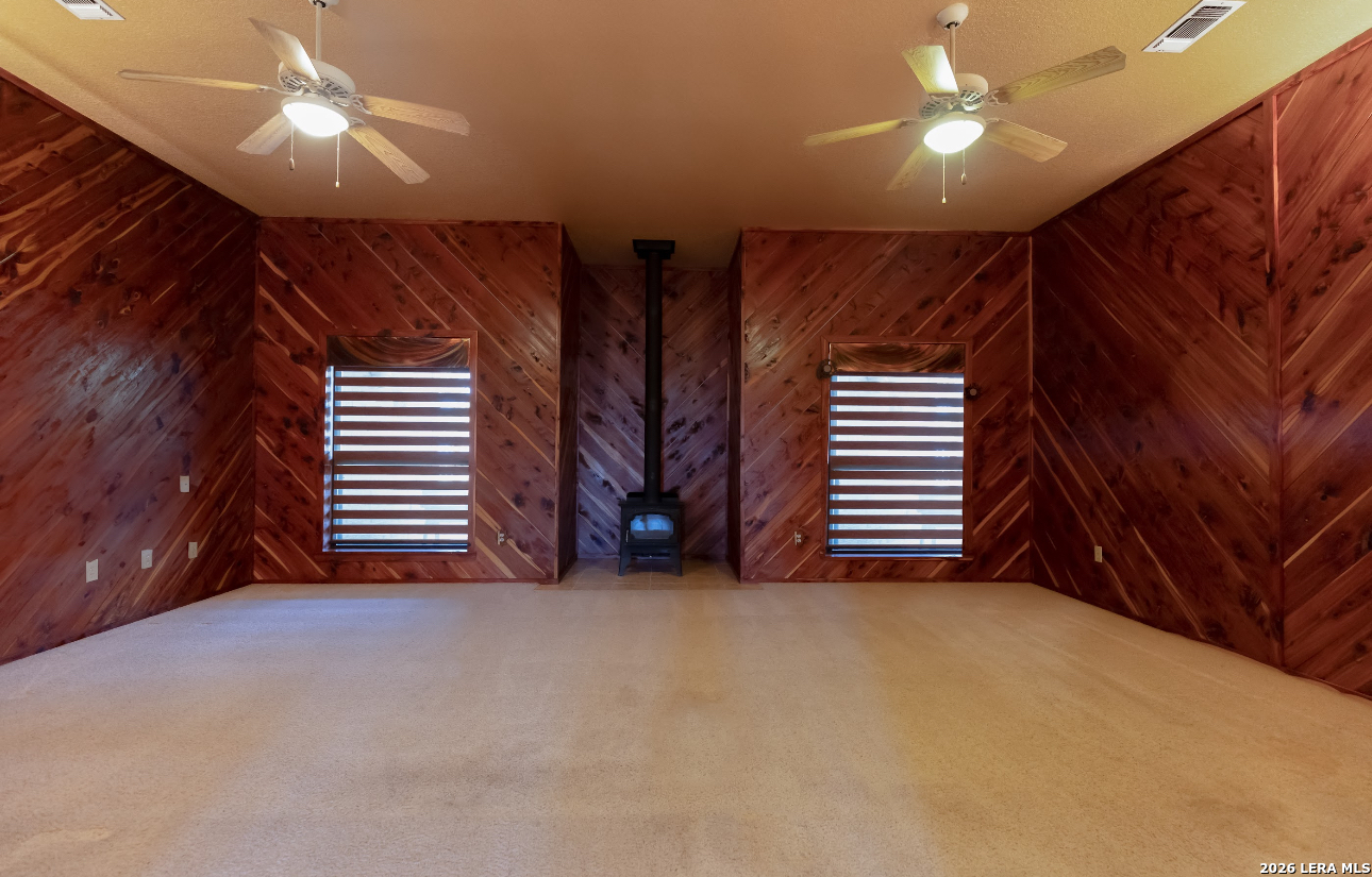 375 Bluntzer Road Jourdanton, TX 78026 - Photo 27 of 44 a view of empty room with ceiling fan